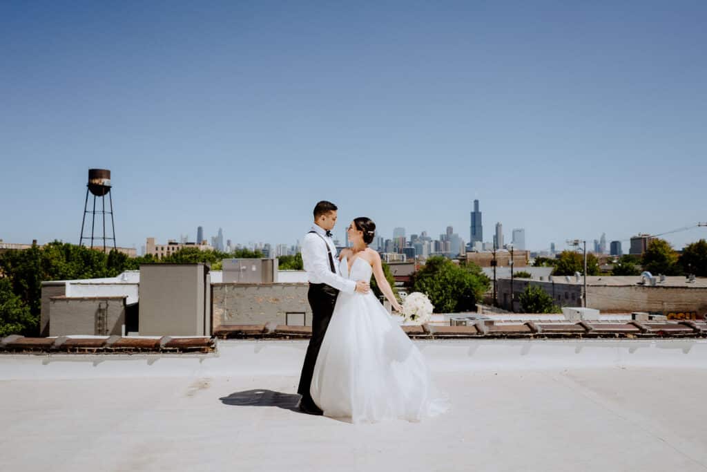 Rooftop wedding portrait of bride and groom at Walden Chicago
